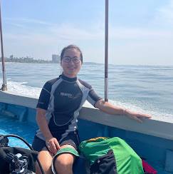Female Guest Wetsuit Boat Portrait